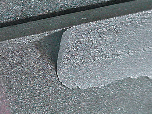 36. ZINC METAL SPRAYED REPAIR APPLIED TO INADEQUATELY BLASTED SURFACES OR NOT WIRE BRUSHED AFTER APPLICATION